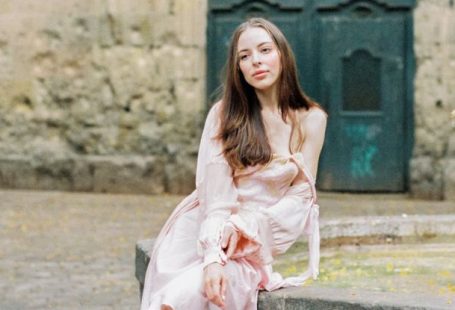 Gothic Quarter - Woman in Pink Dress Sitting on Concrete Bench