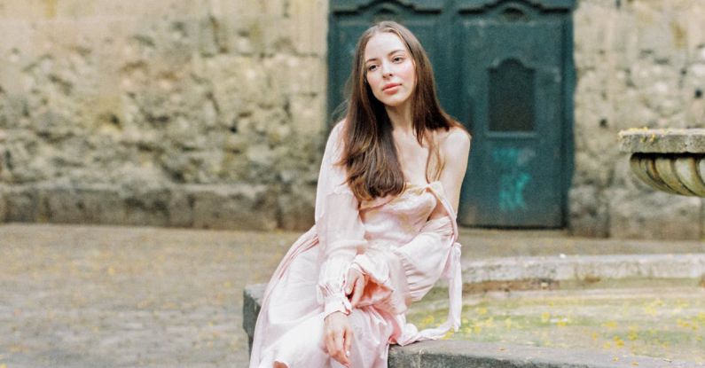 Gothic Quarter - Woman in Pink Dress Sitting on Concrete Bench