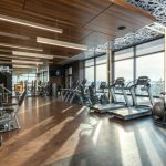 Spas And Wellness Centers - Interior of modern fitness club with various machines and equipment