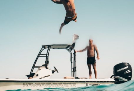 Leisure Cruise - Photo of Man Jumping from Boat to the Sea