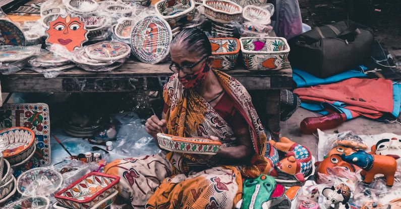Handcrafted Souvenirs - A Woman Sitting on the Floor